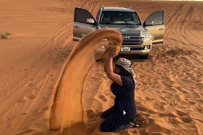 Morning Desert Safari with Sandboarding & Camel Ride on Red Dunes - Camel Ride, Camel Farm Walk, and Falcon Photo Stops