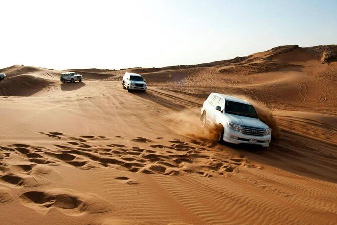 Morning Desert Thrill: Quad Bike Safari Escape - Quad biking across red dunes: the thrill-and-control mix