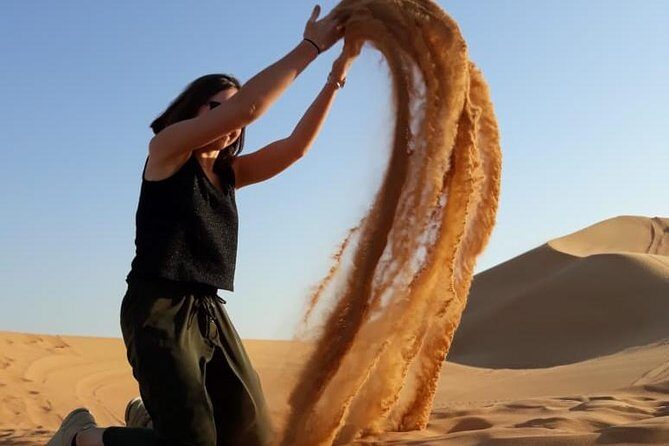 Morning Dubai Red Dunes Safari with Camel Riding & Sand Boarding - Campsite Extras at the Meeting Point: henna, shows, and Ramadan rules