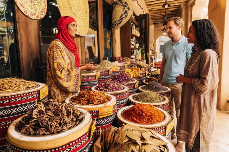 Old Dubai Historic Guided Tour: Creek, Street Food & Souks - Street snacks along the way: karak tea and samosas fuel the souk sprint