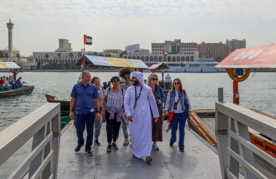 Old Dubai Historic Guided Tour: Creek, Street Food & Souks - Crossing Dubai Creek on an abra: skyline contrast without the big-tour bus