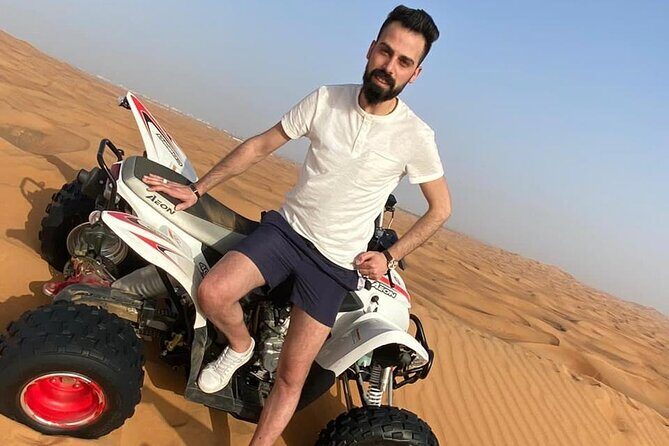 One hour Quad Bike at Red Sand Desert Safari with Camel Ride and BBQ Dinner - Red Sands in one day: quads, camels, henna, and a proper show