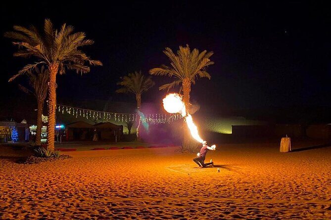 One hour Quad Bike at Red Sand Desert Safari with Camel Ride and BBQ Dinner - The evening show: belly dance, fire dance, and Tanura under desert skies