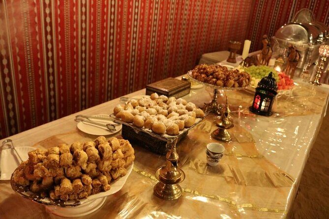 One hour Quad Bike at Red Sand Desert Safari with Camel Ride and BBQ Dinner - Price and value for about $125.60 per person