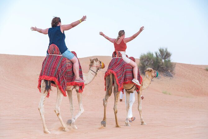 Overnight Desert Escape and Ballooning - Your day 1 desert camp: BBQ dinner, shows, henna, and sandboarding