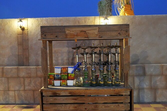 Premium Deluxe Dubai Safari with Camel Ride, Sandboard & BBQ - The live shows: Tanura, belly dance, fire show, and live music