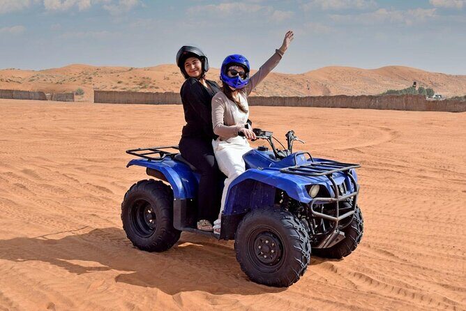 Premium Desert Quad (ATV) Bike Ride Adventure & Sand boarding - Sandboarding on golden dunes: short, fun, and very physical