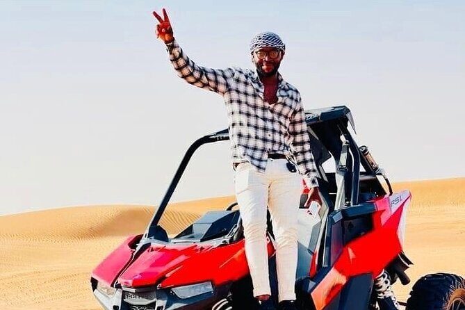 Premium Desert safari With Dune buggy camel ride BBQ dinner - The Edge of Desert: sandboarding and a photo stop that earns its spot