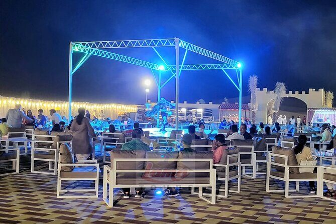Premium Dubai Desert Safari 4x4 with BBQ Dinner - Al Madam Arrival: Welcome Drinks, Costumes, and the Camp Mood