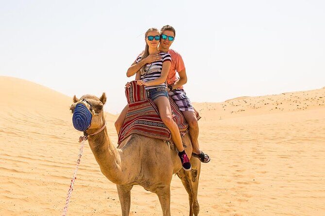 Premium Dubai Evening Red Dune Safari with BBQ Dinner - Desert Camp welcome: Gahwa, dates, and the Bedouin-style rhythm