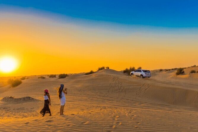 Premium Evening Dessert Safari with BBQ Dinner & Camel Ride - Dune bashing on golden dunes: the thrill, and the stomach reality