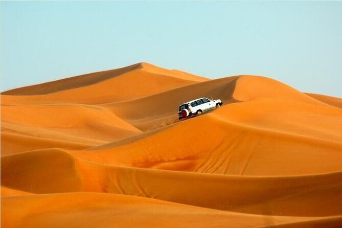 Premium Morning Dessert Safari With Sand Boarding & Dune Bashing - Sandboarding on the Red Dunes: the fun part, plus the reality check