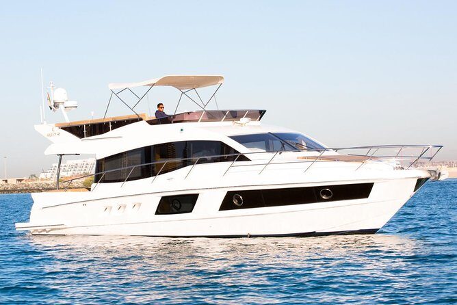 Private Luxury Yacht cruise around Atlantis and Dubai Marina - Entering the yacht: sun deck, flybridge, and indoor saloon comfort