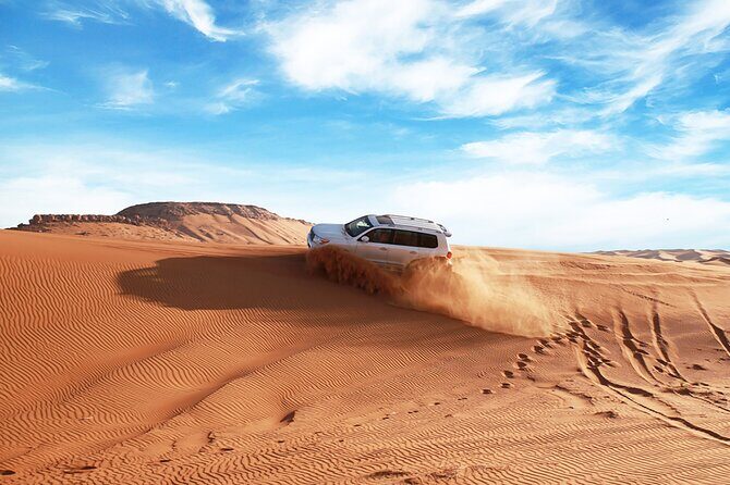 Private Morning Desert Adventure: Sandboarding & Camel Ride - Dune bashing in the red dunes: thrill with a human steering it