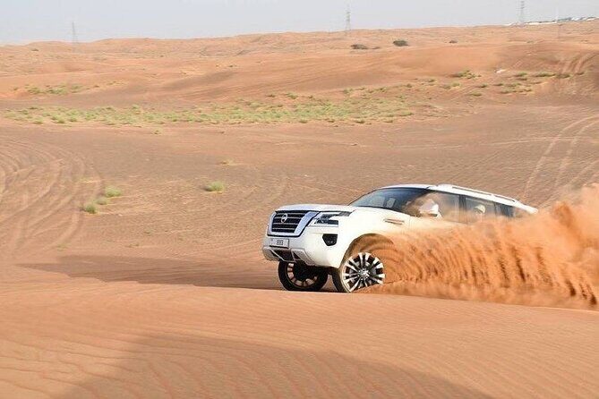 Private Morning Desert Safari with Camel Ride & Sandboarding - The red-dune drive: scenic transition plus a dose of adrenaline