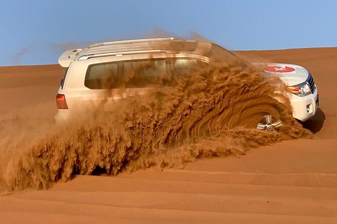 Private Red Dunes Desert Safari , BBQ Dinner and Camel ride - Henna, Camel Memories, and the “Own Table” Difference