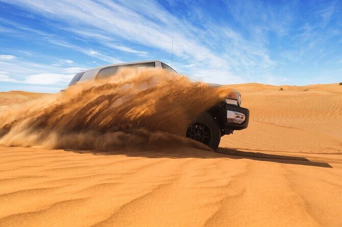 Private Red Dunes Safari with BBQ Dinner and Camel Riding - Getting to the red dunes: pickup and the 4x4 experience