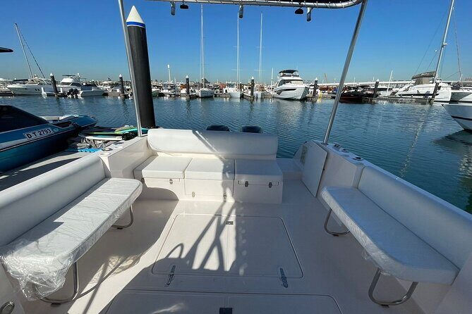 Private Small-Group Dubai Marina Boat Tour - On-board experience: towels, drinks, music, and practical extras