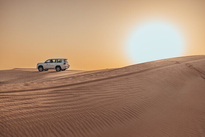 Private Sunset Desert Safari:SandSurfing, Camel Ride & BBQ dinner - From hotel pickup to red dunes: the first hour matters