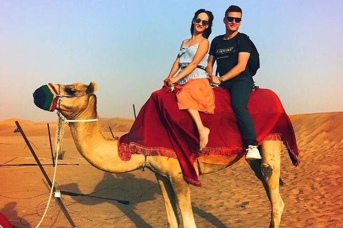 Red Dune 4x4 Desert Safari with Camel ride & BBQ Dinner - The shows: belly dance, fire show, and Tanura in one package