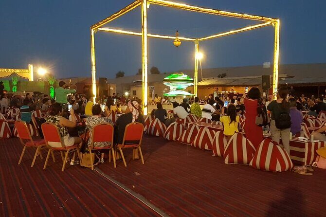Red Dune Desert Safari Dubai Camel Ride Sandboarding & BBQ Dinner - The Camp Scene: Welcome Drinks, Sunset Photos, Henna, and Falcon Photos