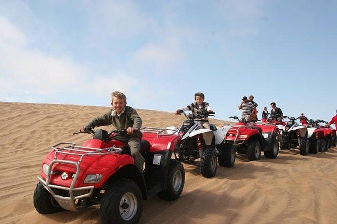Red Dune Safari with Quad Bike Sand Boarding and Camel Ride - Stop 3: quad bike time, then a brief camel ride