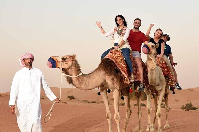 Red Dunes Desert Safari 4x4 Pickup & Drop, Camel Ride BBQ & Shows - Live shows at night: fire, dance, and Tanoura