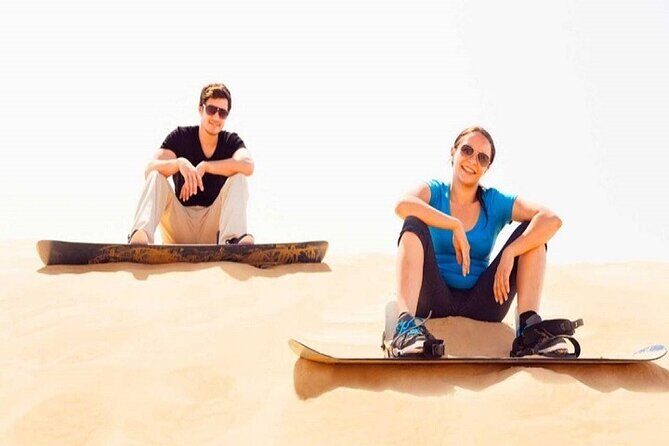 Red Dunes Dubai Desert Safari with Live show, Sandboarding & BBQ - Bedouin camp moments: camel rides, henna, and local dress photos