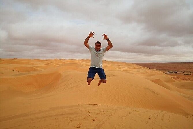 Red Dunes Lahbab Desert Safari With BBQ Dinner - Desert Camp Welcome: Tea, Dates, and Instant Atmosphere