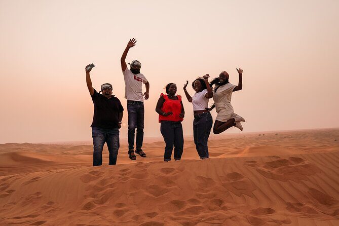 Sunrise Desert Safari - A Magical Morning in Dubai - Stop 3: highest-dune sunrise, sandboarding, and that top-of-dune photo moment