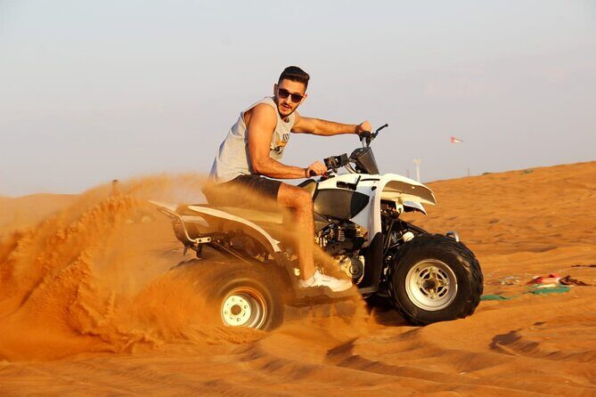 Sunrise Desert safari With Quad bike ride Sandboard & Camel ride - Quad biking in a designated sandpit: fun, fast, controlled