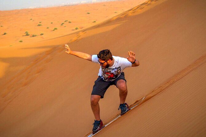 Sunrise Early Morning Desert Safari with Refreshments - Sandboarding slide experience: a different kind of thrill