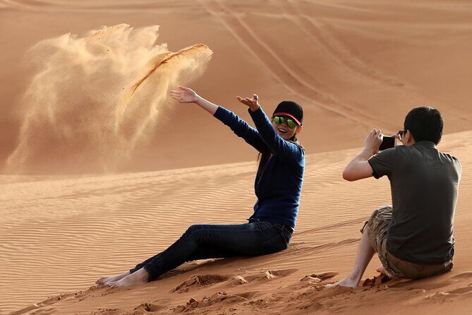 Sunset Camel Trek & Red Dunes Safari with BBQ at Al Khayma Camp From Dubai - The three-show night: belly dance, fire, and Tanoura