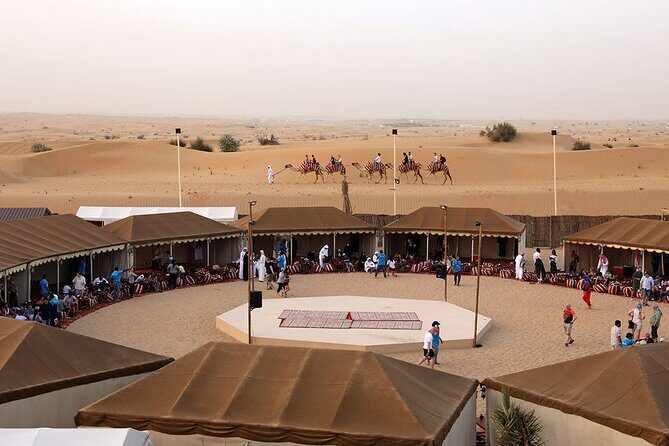 Sunset Camel Trek & Red Dunes Safari with BBQ at Al Khayma Camp From Dubai - Al Khayma Camp: Majilis seating, falcon photo, and desert hospitality