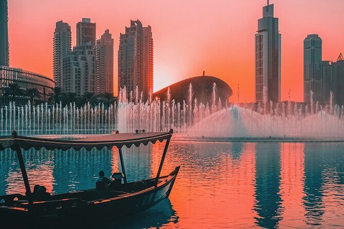Traditional Abra Ride and Dubai Fountain Show at Burj Lake - Cruising past Souk Al Bahar: a shopping district view from the waterline