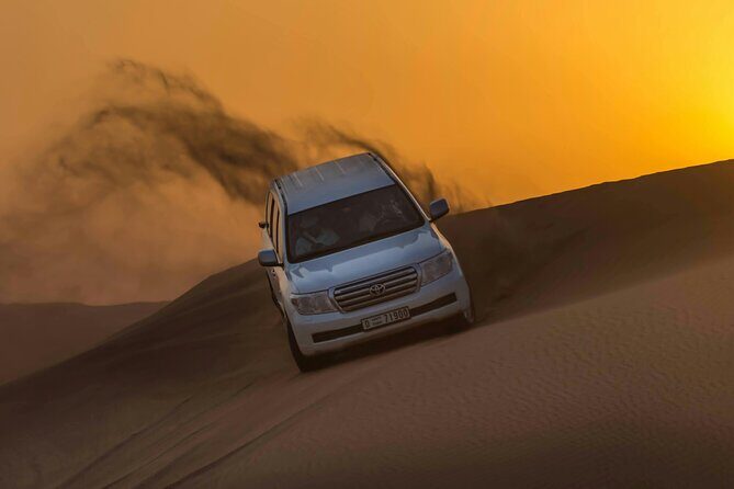 VIP Desert Safari Camel Ride Sand Boarding & BBQ Dinner - The Red Dunes in a 4x4: what dune bashing feels like