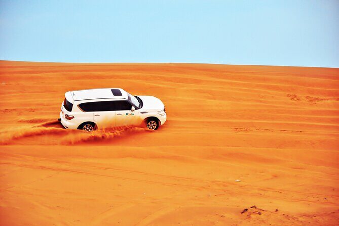 VIP Desert Safari & Dune Bashing with 5<em> Live BBQ – Key things to know before you go’ /></p>
<ul>
<li><strong>Al Belaida dune country first</strong>: you leave the city and head into the sand early for that proper desert feel</li>
<li><strong>Quad bike option</strong>: you can include quad biking if you select it, before the dune bashing gets going</li>
<li><strong>Sunset photo stop in open dunes</strong>: you’ll have time in the middle of the desert for golden-hour shots</li>
<li><strong>Camp activities that are quick but fun</strong>: camel ride, henna for ladies, and photos with a falcon</li>
<li><strong>Live BBQ dinner plus stage entertainment</strong>: belly dancing, fire show, and traditional Tanoura dance</li>
</ul>
<h2 id="leaving-busy-dubai-for-al-belaidas-dune-country">Leaving Busy Dubai for Al Belaida’s Dune Country</h2>
<p><img width="669" height="446" decoding="async" src=