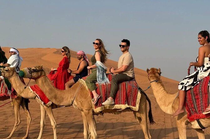 Vip Evening Desert Safari with quad bike,Camel Riding & Dinner - Stop 1: Al Awir camp—camel photos, henna, and five live shows